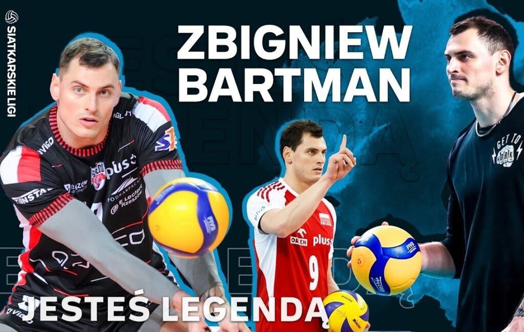 Zbigniew Bartman w akcji na boisku siatkarskim, wykonujący atak lub blok, w tle rozmazana hala sportowa.